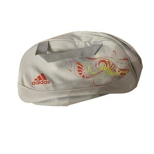 Adidas Cream and Red Sports Bag for travel accessories